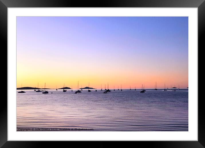 Boats in Silhouette against a Rainbow Sunset Framed Mounted Print by Julie Gresty