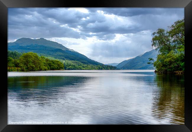 Serene Reflections on Loch Eck Framed Print by RJW Images