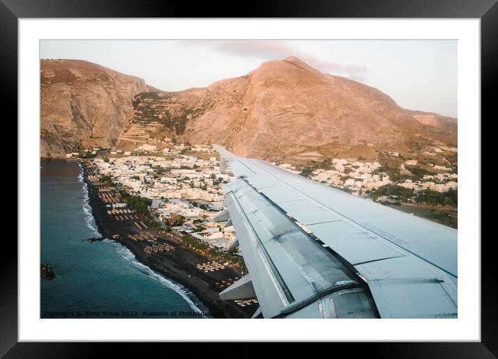 Airplane is landing in Santorini Island Framed Mounted Print by Simo Wave