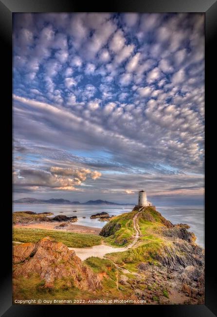 Llanddwyn lighthouse Anglesey  Framed Print by Guy Brennan