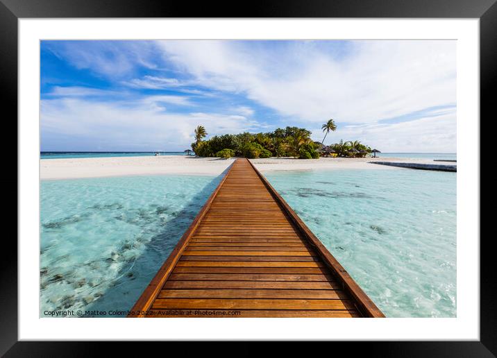 Wooden jetty to a tropical island, Maldives Framed Mounted Print by Matteo Colombo