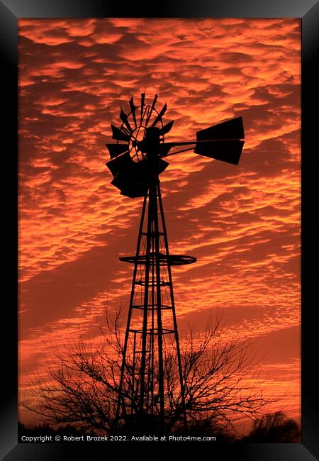 Kansas Sunset with a colorful Sky with a Windmill  Framed Print by Robert Brozek