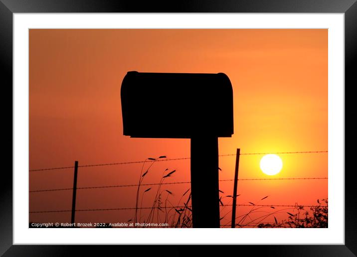 Mailbox silhouette at sunset with orange sky Framed Mounted Print by Robert Brozek
