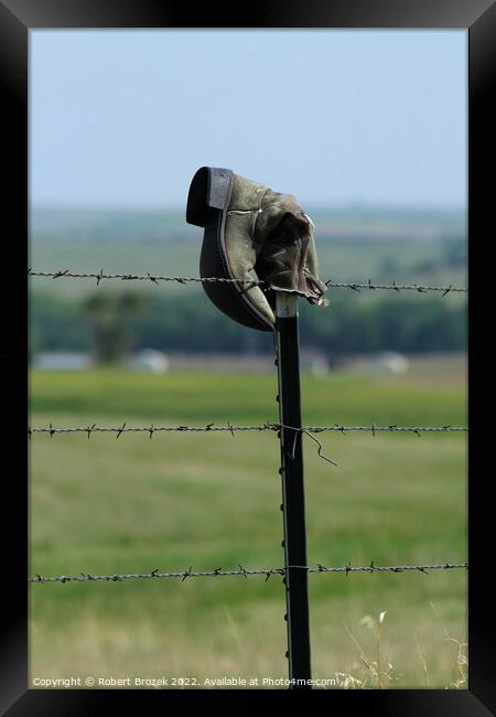Cowboy boot on a fence with grass Framed Print by Robert Brozek