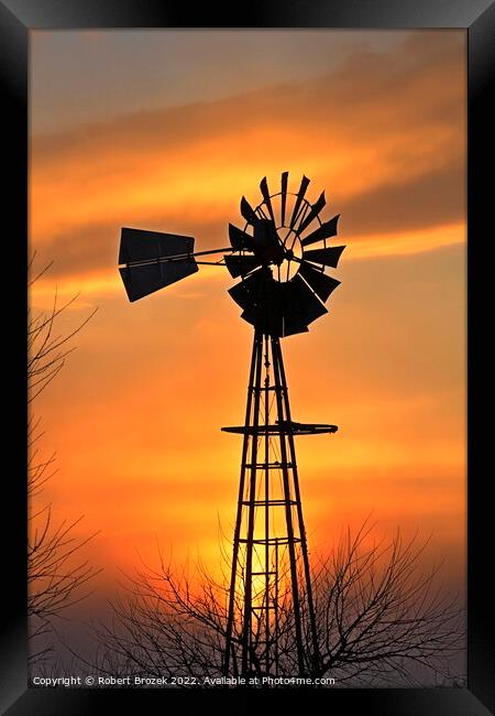 Kansas Golden Sunset with a windmill silhouette Framed Print by Robert Brozek