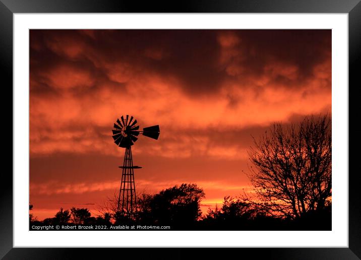 Windmill silhouette with a Sunset Framed Mounted Print by Robert Brozek