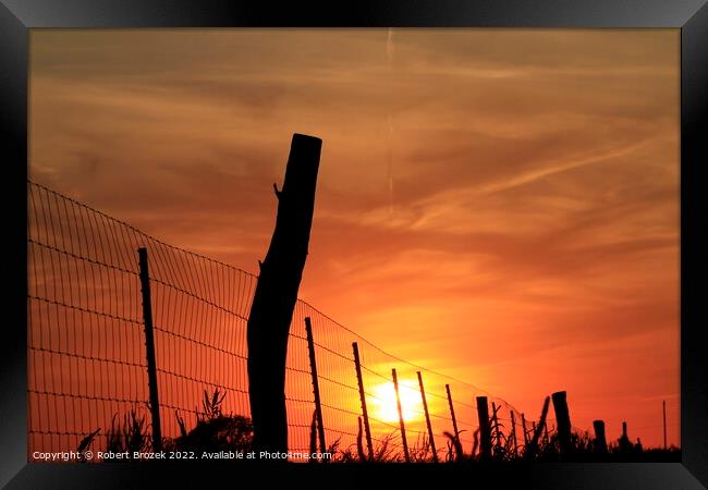 Outdoor sunset with Sun and fence silhouette Framed Print by Robert Brozek