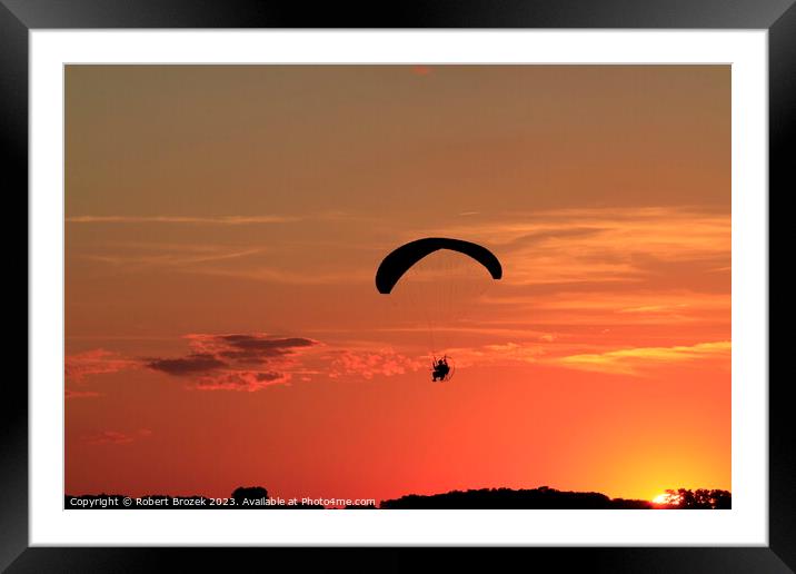 Paraglider at Sunset with a colorful sky. Framed Mounted Print by Robert Brozek