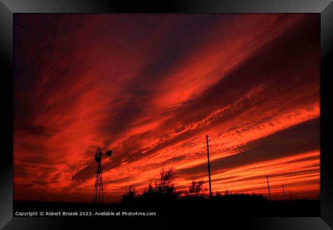 Kansas Blazing Red Sunset with a Windmill Silhouette Framed Print by Robert Brozek