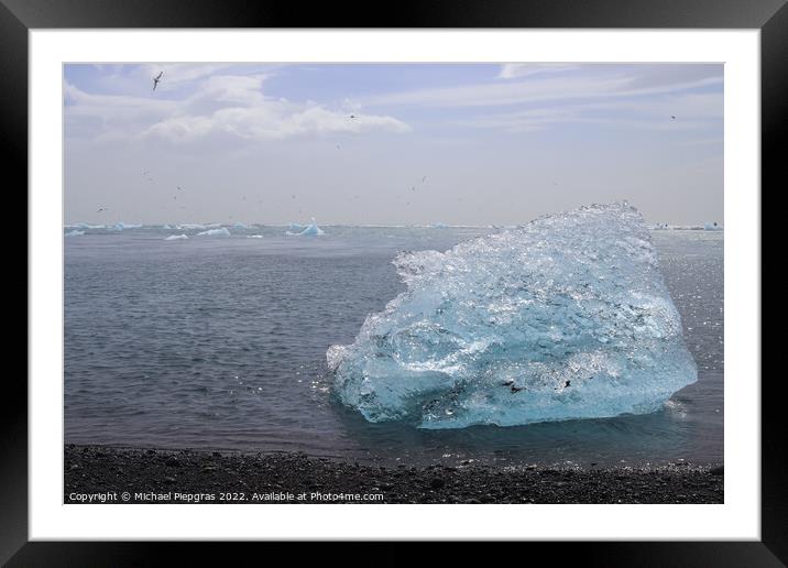 Diamond Beach in Iceland with blue icebergs melting on black san Framed Mounted Print by Michael Piepgras