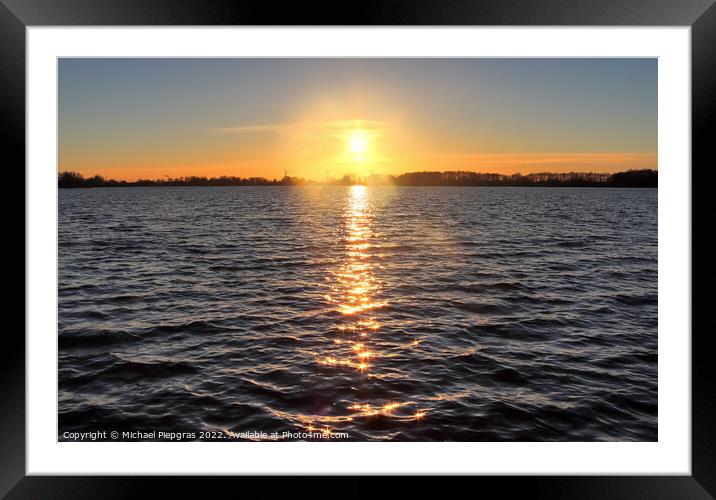 Beautiful and romantic sunset at a lake in yellow and orange col Framed Mounted Print by Michael Piepgras