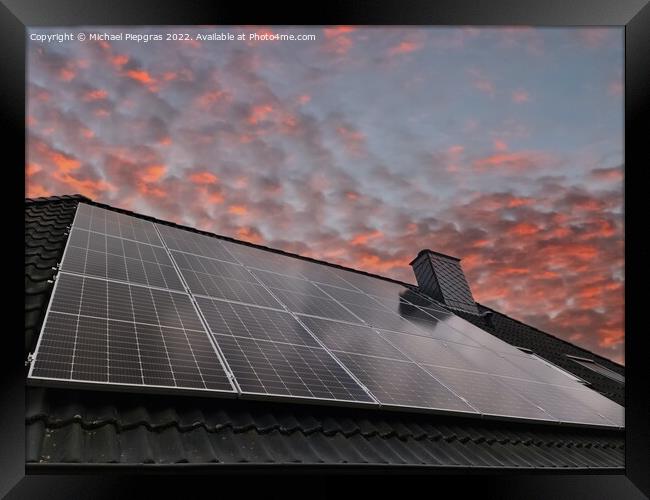 Solar panels producing clean energy on a roof of a residential h Framed Print by Michael Piepgras