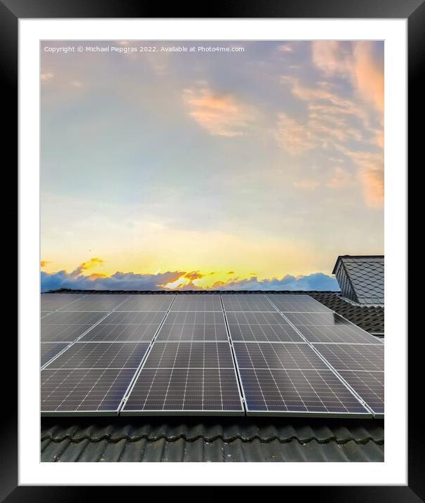 Solar panels producing clean energy on a roof of a residential h Framed Mounted Print by Michael Piepgras