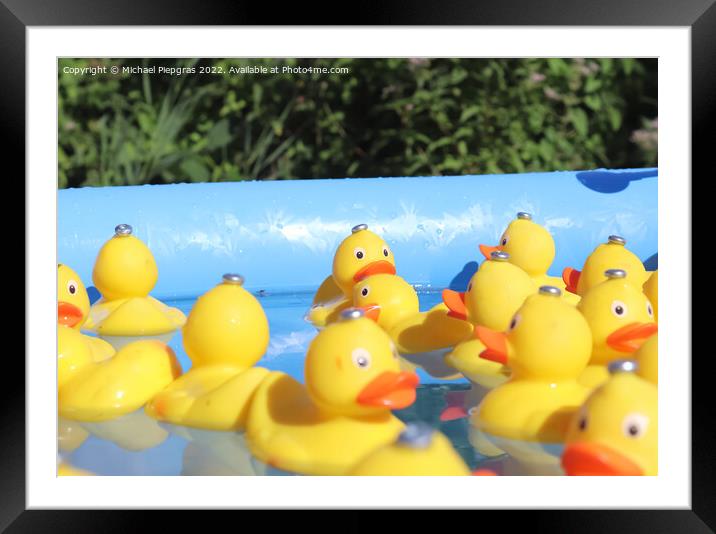 Selective focus. Many yellow rubber ducks swimming in circles in Framed Mounted Print by Michael Piepgras