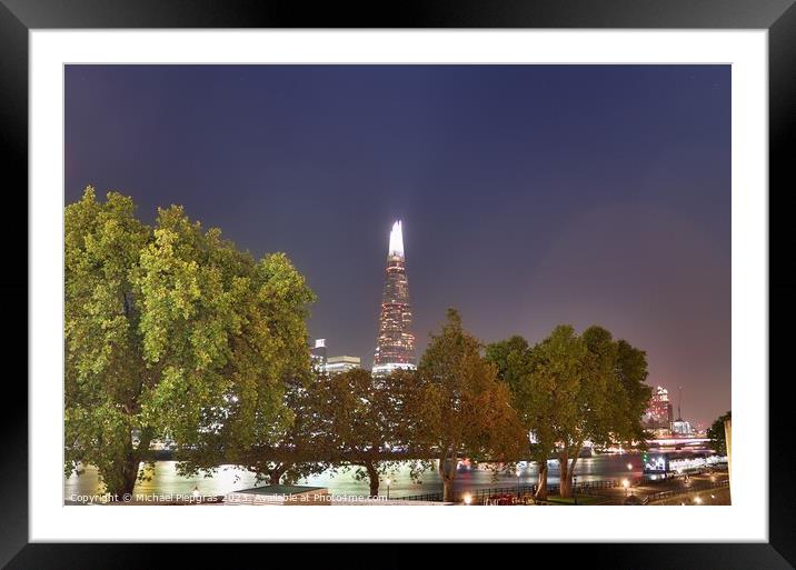 View of the London skyline at night with river thamse and lots of light Framed Mounted Print by Michael Piepgras