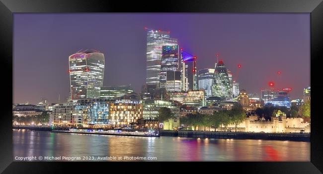 View of the London skyline at night with river thamse and lots of light Framed Print by Michael Piepgras