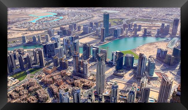 Aerial view over the city center of dubai on a sunny day Framed Print by Michael Piepgras