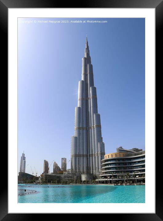 View at the Burj Khalifa on a sunny day. Burj Khalifa is currently the tallest building in the world, at 829.84 m (2,723 ft) Framed Mounted Print by Michael Piepgras