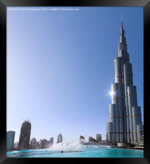 View at the Burj Khalifa on a sunny day. Burj Khalifa is currently the tallest building in the world, at 829.84 m (2,723 ft) Framed Print by Michael Piepgras