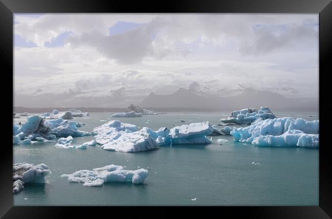 Iceland, Jokulsarlon Lagoon, Turquoise icebergs floating in Glacier Lagoon on Iceland. Framed Print by Michael Piepgras