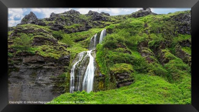 Long exposure of a waterfall in a rocky landscape in Iceland Framed Print by Michael Piepgras