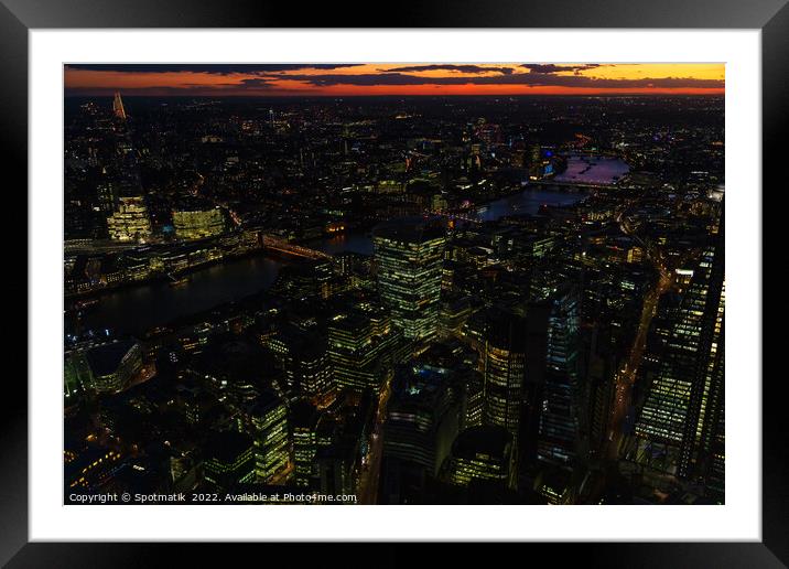 Aerial London illuminated night view financial business center  Framed Mounted Print by Spotmatik 