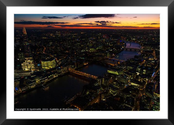 Aerial illuminated London city the financial business center  Framed Mounted Print by Spotmatik 