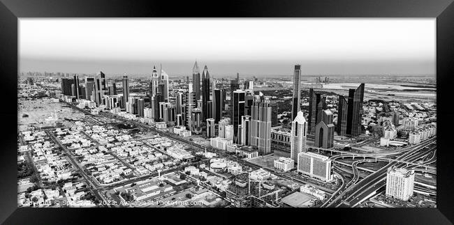 Aerial cityscape sunset view of Dubai city UAE Framed Print by Spotmatik 