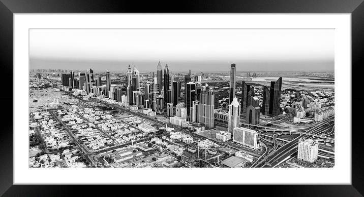 Aerial cityscape sunset view of Dubai city UAE Framed Mounted Print by Spotmatik 