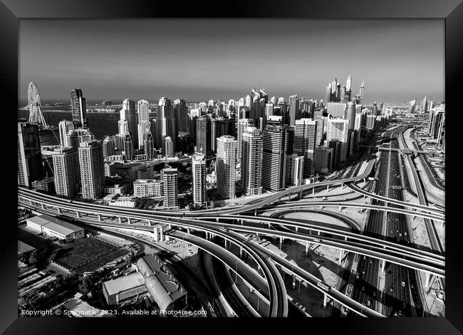 Aerial Dubai city skyscrapers highway interchange Framed Print by Spotmatik 
