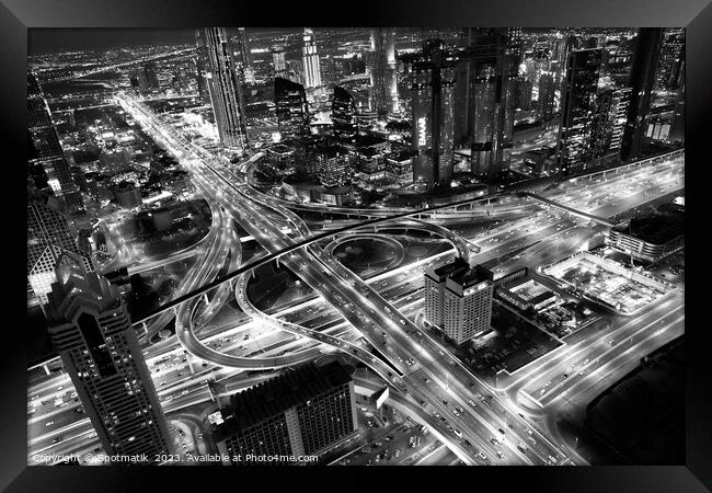 Aerial night Dubai Intersection Sheikh Zayed Road  Framed Print by Spotmatik 
