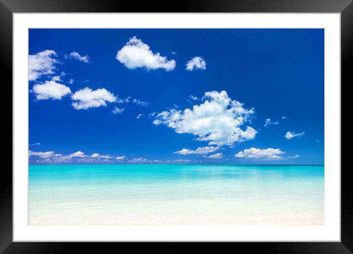 View of blue ocean and white sandy beach Framed Mounted Print by Spotmatik 