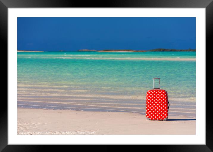 Red polka dot travel suitcase on sand beach Framed Mounted Print by Spotmatik 