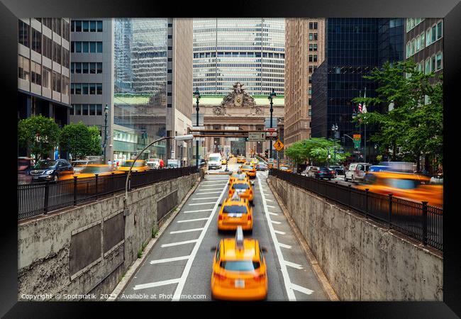 Yellow taxi cabs surfacing from underpass New York Framed Print by Spotmatik 