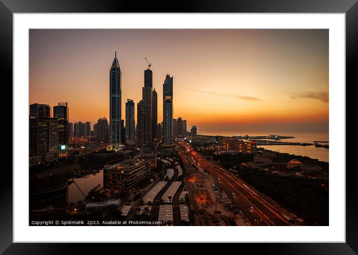 Dubai sunset Sheikh Zayed Road Media city skyscrapers  Framed Mounted Print by Spotmatik 