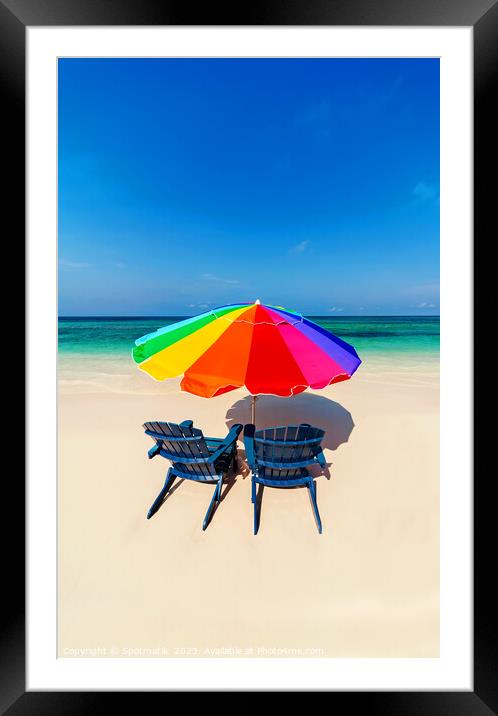 Parasol  beach chairs on white tropical sandy shoreline Framed Mounted Print by Spotmatik 