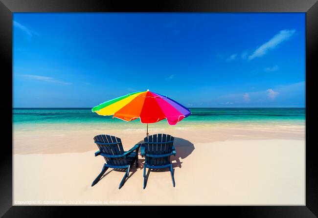 Parasol and chairs on sandy beach Bahamas Caribbean Framed Print by Spotmatik 