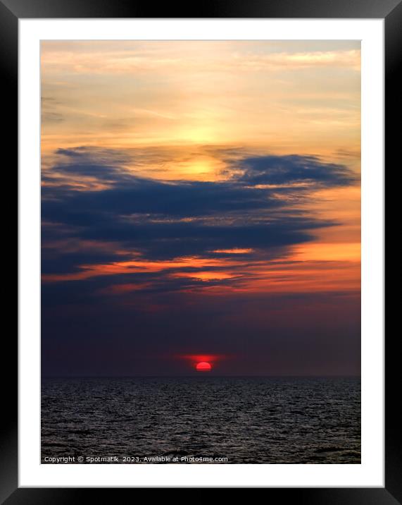 Sunset dusk view of setting sun ocean horizon  Framed Mounted Print by Spotmatik 