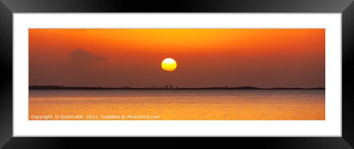 Panoramic orange sky over tranquil ocean at sunset Framed Mounted Print by Spotmatik 