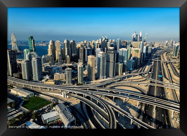 Aerial Dubai city skyscrapers modern highway interchange UAE Framed Print by Spotmatik 