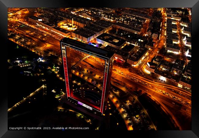 Aerial illuminated night view Dubai city Frame UAE  Framed Print by Spotmatik 