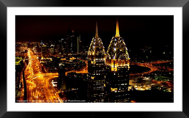 Aerial illuminated Downtown night view of Dubai UAE Framed Mounted Print by Spotmatik 