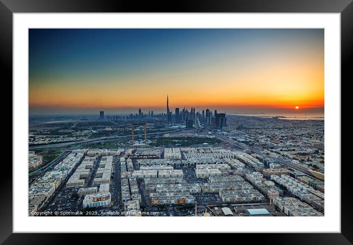Aerial sunset view of Dubai city skyscrapers UAE  Framed Mounted Print by Spotmatik 