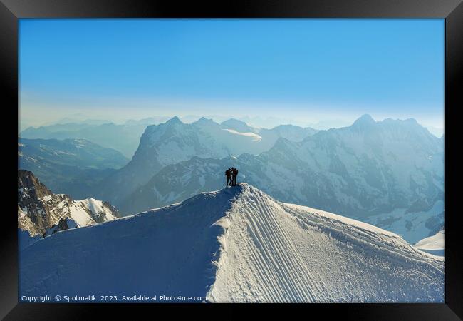 Aerial Switzerland two climbers on mountain summit Europe Framed Print by Spotmatik 