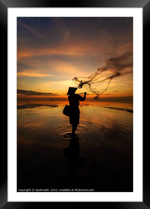 Balinese fisherman casting net Flores sea at sunrise Framed Mounted Print by Spotmatik 