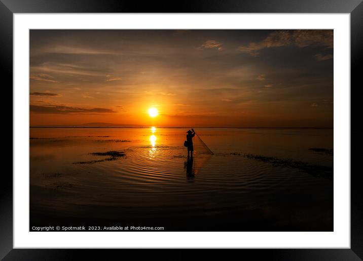 Silhouette Balinese sunrise fisherman casting net Flores sea Framed Mounted Print by Spotmatik 