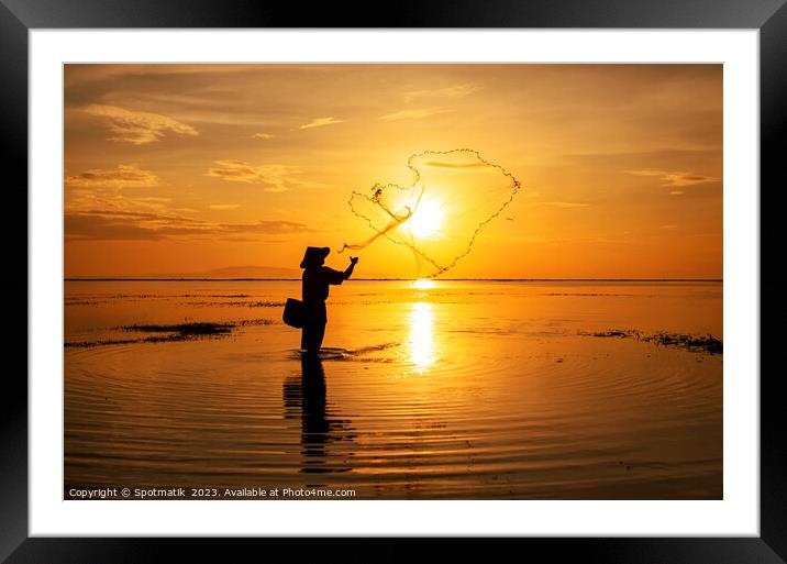 Sunrise Silhouette local Balinese fisherman casting his net  Framed Mounted Print by Spotmatik 