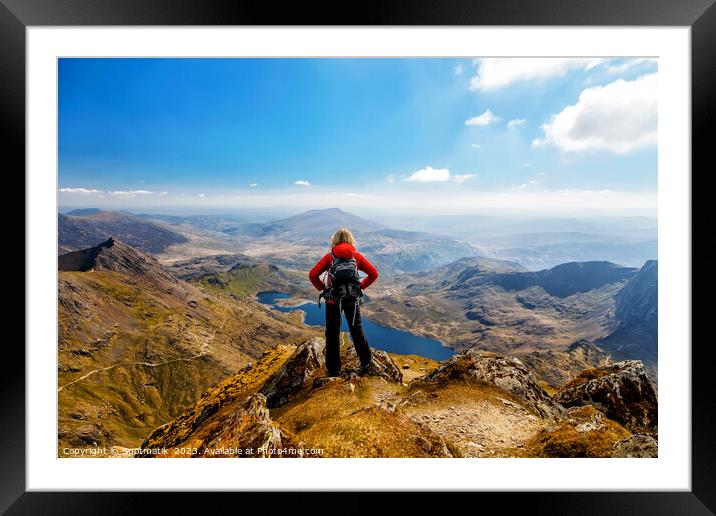 Wales young Caucasian female hiker celebrating her achievement  Framed Mounted Print by Spotmatik 