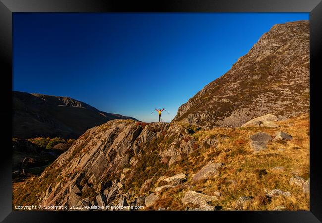 Scenic views across Snowdonia for outdoor female hiker Framed Print by Spotmatik 