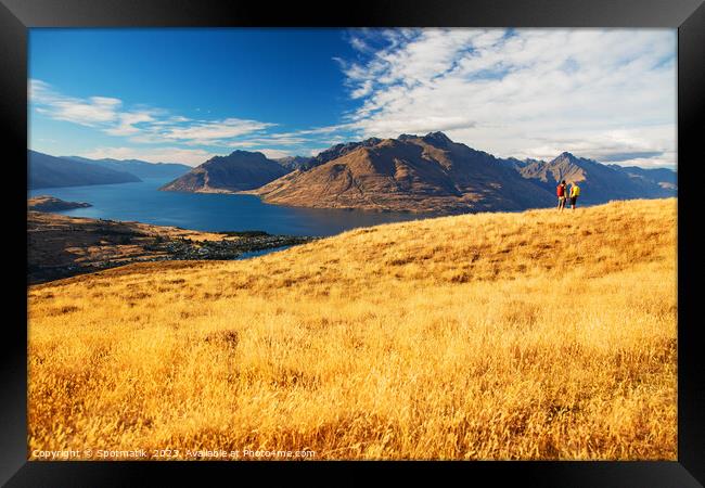 Adventure couple on vacation hiking trip South Island Framed Print by Spotmatik 